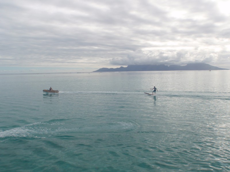 Steve surfing behind the dingy