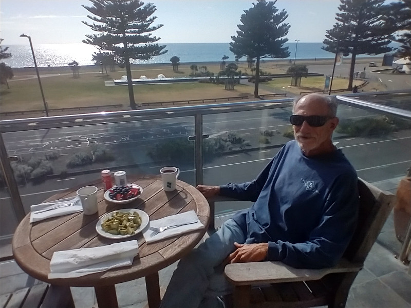 Napier Breakfast on the Balcony with old cars driving by